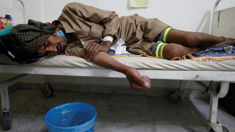 A man lies on the bed of a cholera treatment center in Sanaa, Yemen
