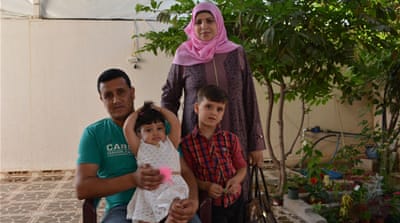 Rezeq Abu Setta's daughter, Salma, was born just two days before he attempted suicide [Mersiha Gadzo/Al Jazeera] 