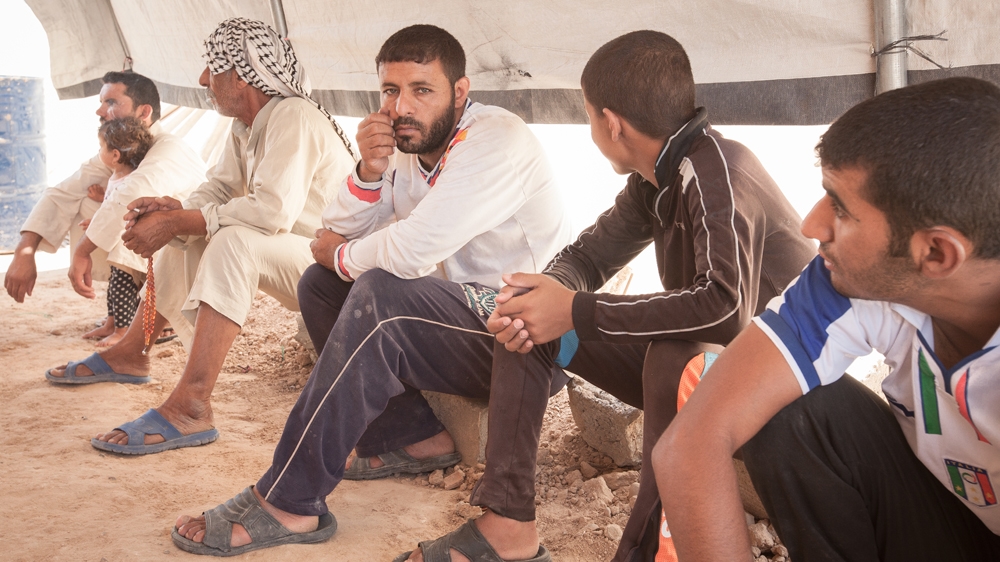 In addition to the movement restrictions, civilians detained in Shahama camp said they were barred from having mobile phones [Sebastian Castelier/Al Jazeera]