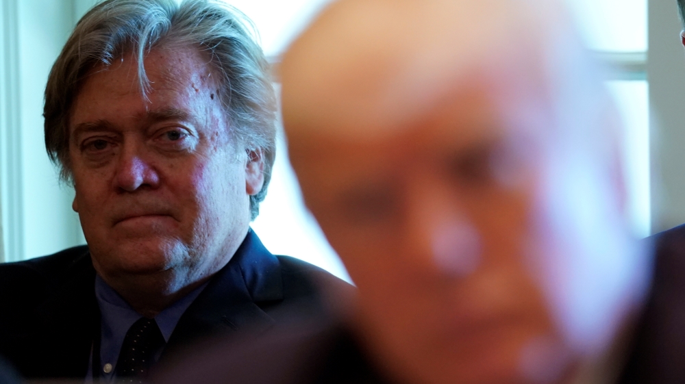 Trump advisers Bannon and Kushner listen as U.S. President Donald Trump meets with members of his Cabinet at the White House in Washington