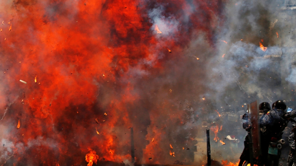 At least 10 people were killed in clashes as Sunday's controversial vote went ahead [Carlos Garcia Rawlins/Reuters]