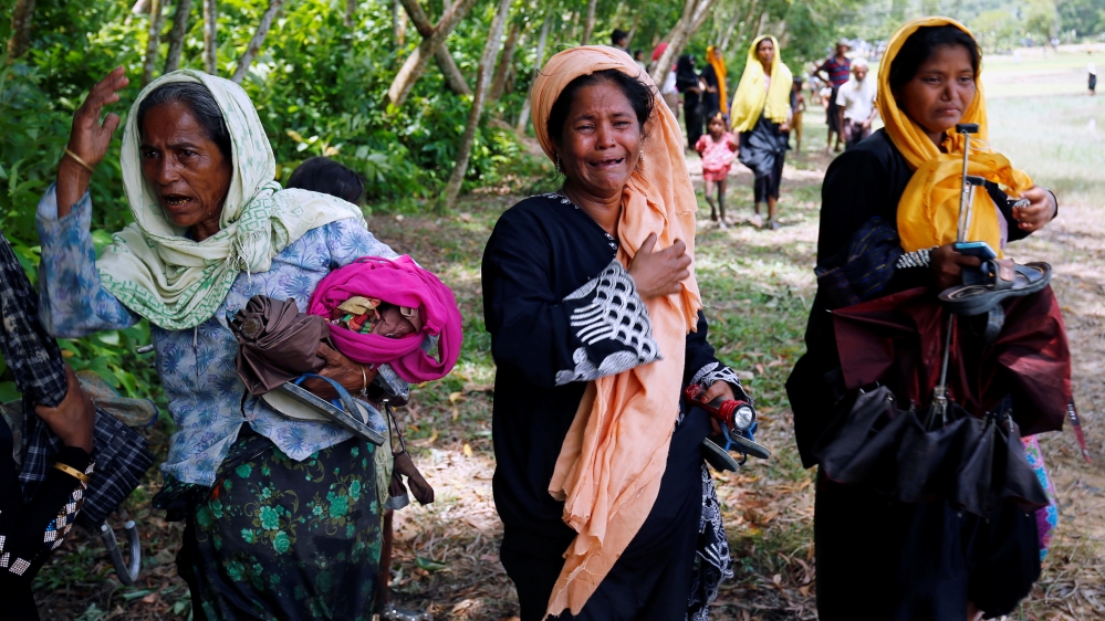 Rohingya women cry after being restricted by BGB to enter into Bangladesh side, in Cox’s Bazar