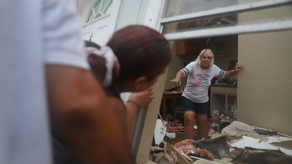 Many residents stayed put in imperilled towns and stocked up on food, fuel and sandbags [Joe Raedle/AFP]