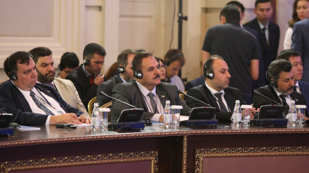 Members of the Syrian opposition delegation attend the round on Syria peace talks in Astana