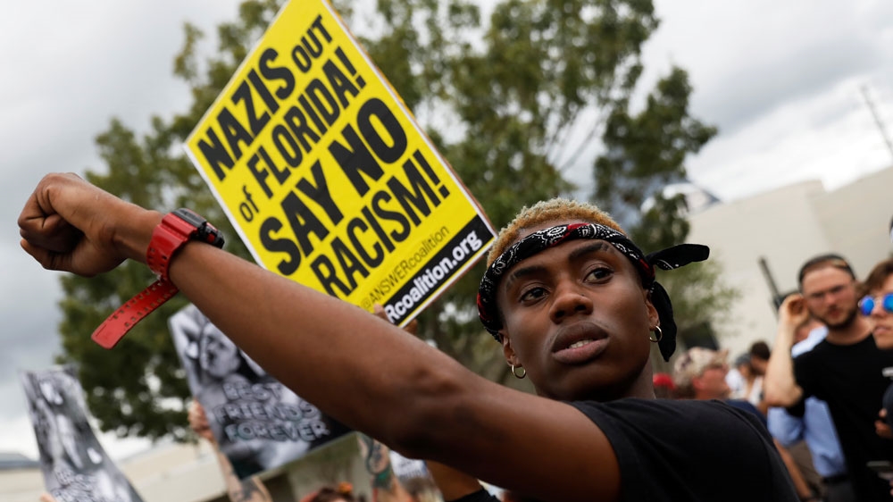 According to local media, at least 1,000 people joined the march against Richard Spencer on Thursday [Shannon Stapleton/Reuters] 