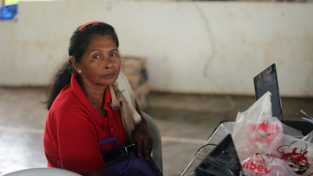 Pidinsia Barahama Pareda waits for the release of her birth certificate on the Philippine island of Balut [Mick Basa/Al Jazeera]