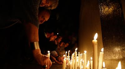 

People place candles outside the Polytechnic School during a vigil in Rosario, Argentina [AP Photo] 

People place candles outside the Polytechnic School during a vigil in Rosario, Argentina [AP Photo] 