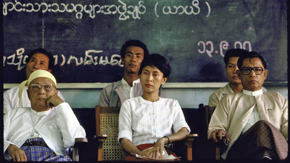 Aung San Suu Kyi sits with other pro-democracy leaders [Sandro Tucci/Getty Images]
