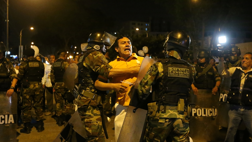 Angry protesters clashed with police in Lima on Monday [Guadalupe Pardo/Reuters]
