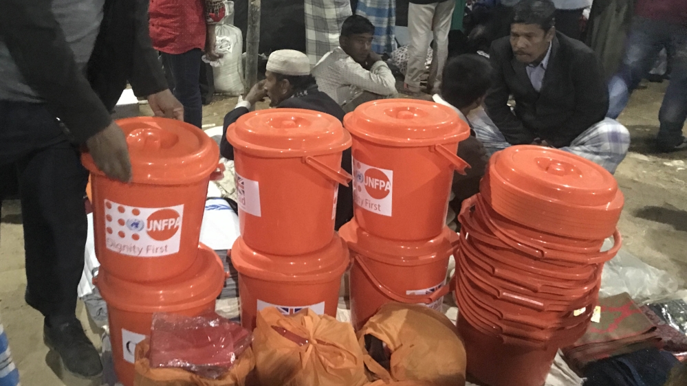 Food assistance supplies are bought and sold in makeshift marketplace in Bangladesh [Ashish Malhotra/Al Jazeera]