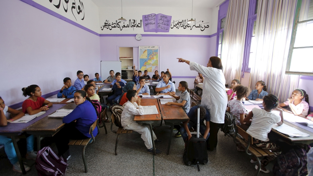 Schoolchildren listen to a teacher as they study during a class in the Oudaya primary school in Rabat, September 15, 2015, at the start of the new school year in Morocco. Nearly three years after Tali