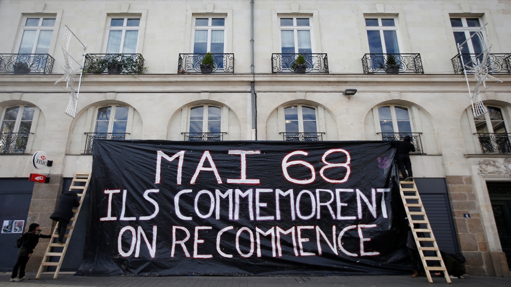 Protestor display a banner which reads : ''May 1968, they commemorate, we start again" during a demonstration against French government reforms in France, November 16, 2017. [Stephane Mahe/Reut