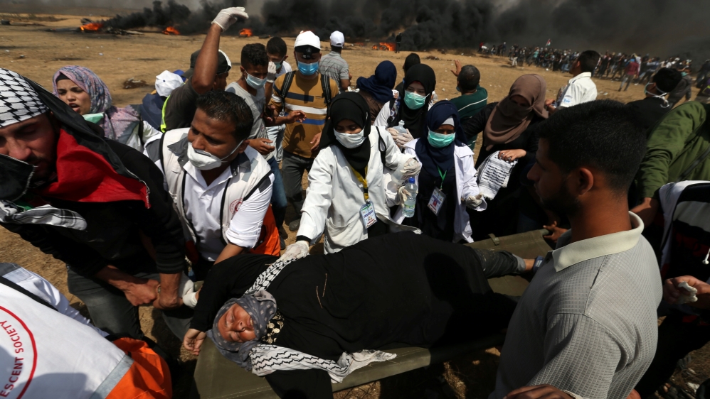 
A female demonstrator is evacuated after inhaling tear gas fired by Israeli troops at the Israel-Gaza border [Ibraheem Abu Mustafa/Reuters]

Palestinian protesters run from tear gas launched by Israeli forces during the Great March of Return in Khan Younis in the southern Gaza Strip [Mustafa Hassona/Anadolu Agency]  

Palestinians shout slogans as they protested on Friday [Mustafa Hassona/Anadolu Agency]

Palestinian protesters run from tear gas launched by Israeli forces during the Great March of Return in Khan Younis in the southern Gaza Strip [Mustafa Hassona/Anadolu Agency]  

Palestinians shout slogans as they protested on Friday [Mustafa Hassona/Anadolu Agency]

Palestinians shout slogans as they protested on Friday [Mustafa Hassona/Anadolu Agency]