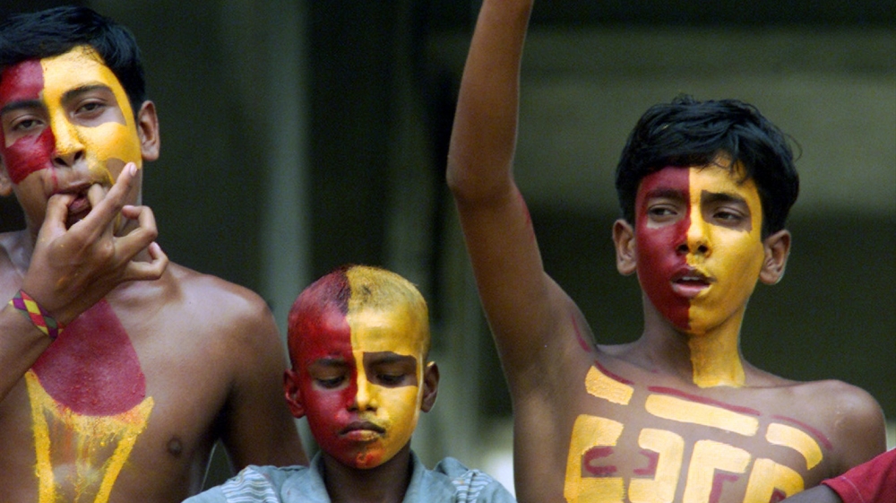 Indian soccer fans, with their body painted in the colour of their East Bengal club [File/Reuters]