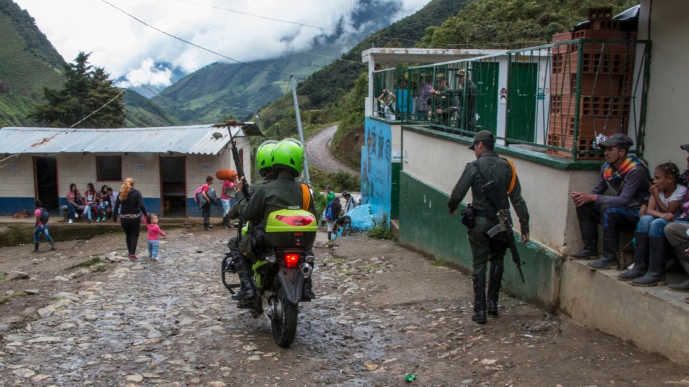 Soldiers patrol the village of Santa Lucia [Nicolas Bedoya/Al Jazeera]