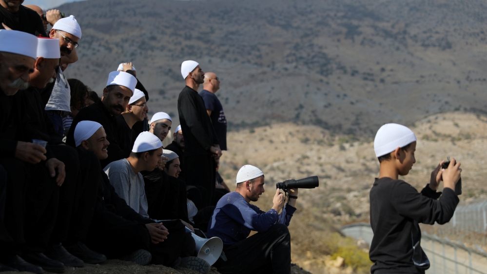 Druze gather to contact their relatives on the Syrian side, in the Israeli-occupied Golan Heights [File: Reuters]