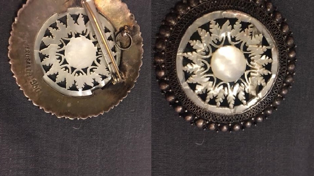 The Jerusalem brooches Mary Muzher, Sirhan Sirhan's mother, came with to the US in 1956 [Sherifa Zuhur/Al Jazeera]