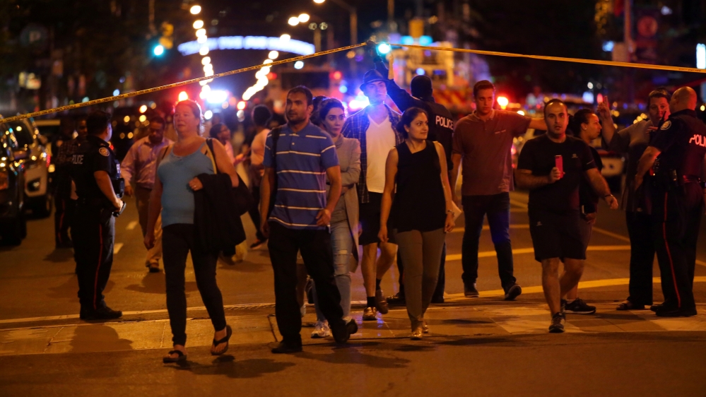 People leave an area taped off by police near the scene of the mass shooting [Chris Helgren/Reuters]