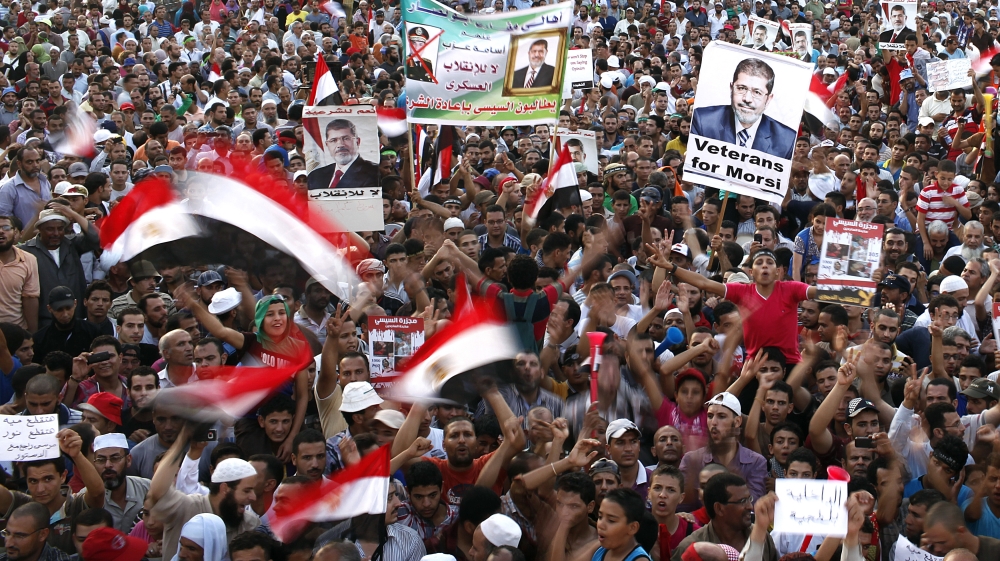 Members of the Muslim Brotherhood and supporters of deposed Egyptian President Mohamed Mursi chant slogans at Rabaa Adawiya Square east of Cairo August 11, 2013