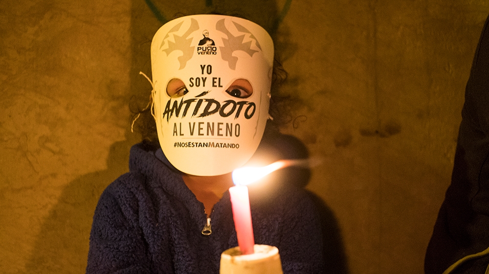 A child holds a candle in protest of the activists killed since the signing of peace agreements in Colombia, Bogota on July 6, 2018. (Photo by Daniel Garzon Herazo/NurPhoto)