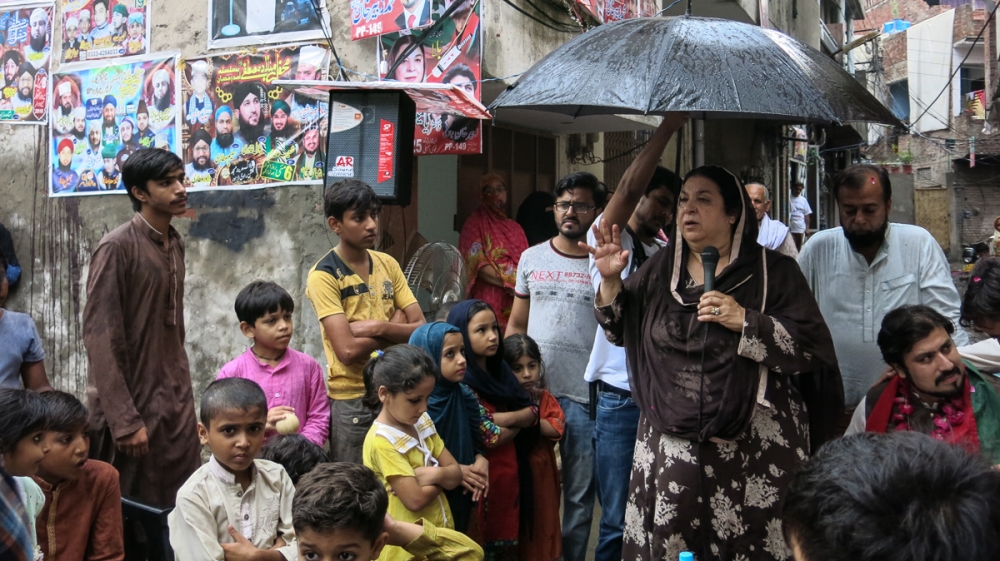 PTI candidate Yasmin Rashid addressees a corner meeting in the eastern city of Lahore [Al Jazeera]