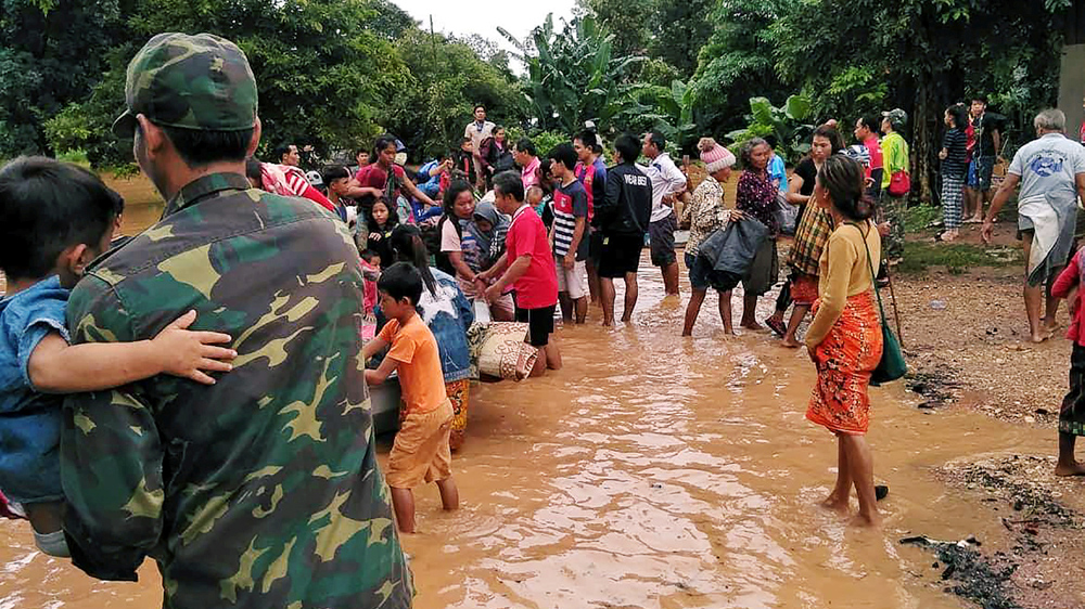 
Villagers evacuate after the Xepian-Xe Nam Noy hydro-power dam collapsed in Attapeu province [ABC Laos News via Reuters]
