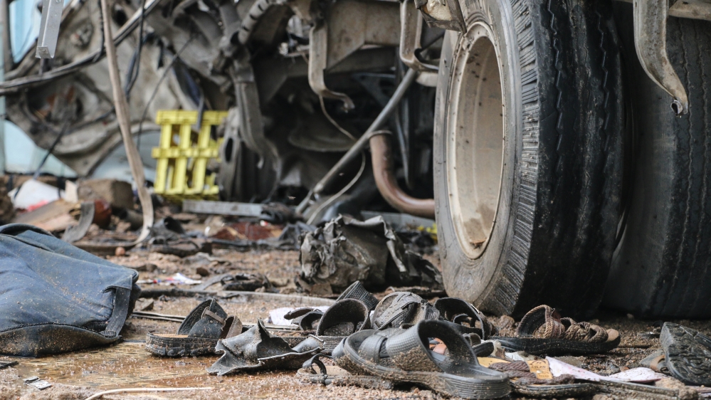 Childrens shoes, sandals and bloodstained UNICEF rucksacks were still at the scene of the air strike [Ahmad Algohbary/Al Jazeera]