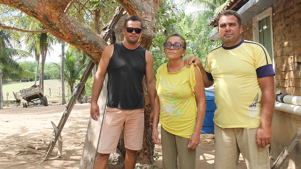 Hilda Isabel da Silva will receive 88,000 Brazilian real (about $21,100) for her home where she lives with her sons Jailson and Nildo [Sam Cowie/Al Jazeera]