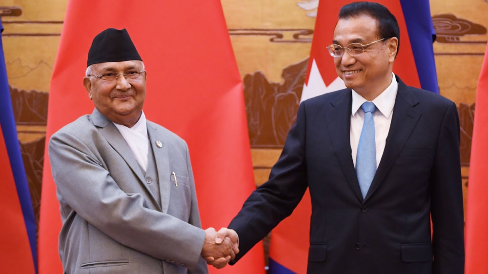 Nepal''s Prime Minister K.P. Sharma Oli shakes hand with Chinese Premier Li Keqiang
