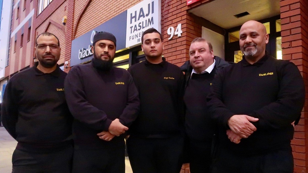 The Haji Taslim Funerals team, including members of the Taslim family who founded the business in 1960. [Al Jazeera]