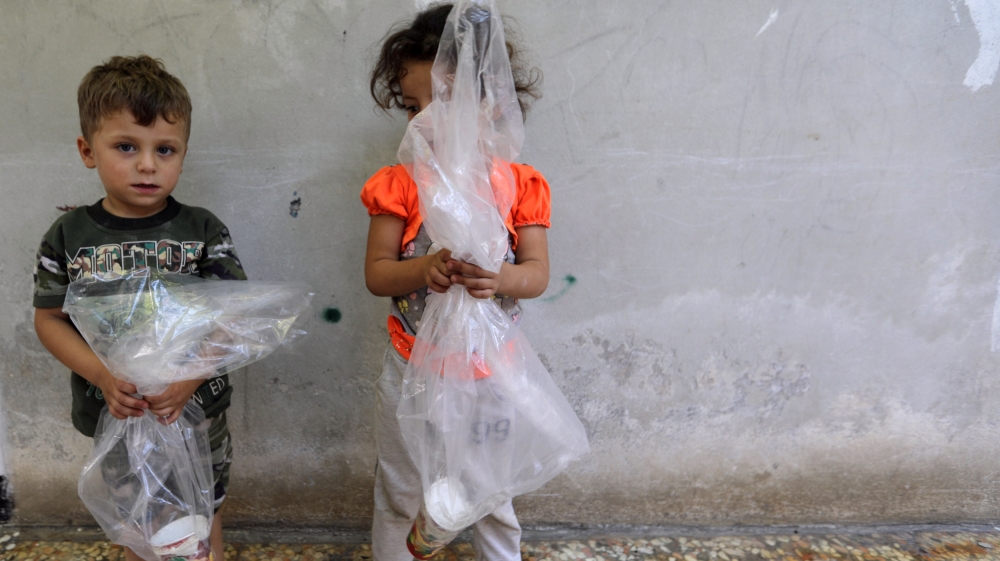 Amid fears of a chemical attack, Idlib residents have started taking precautionary measures [Khalil Ashawi/Reuters]