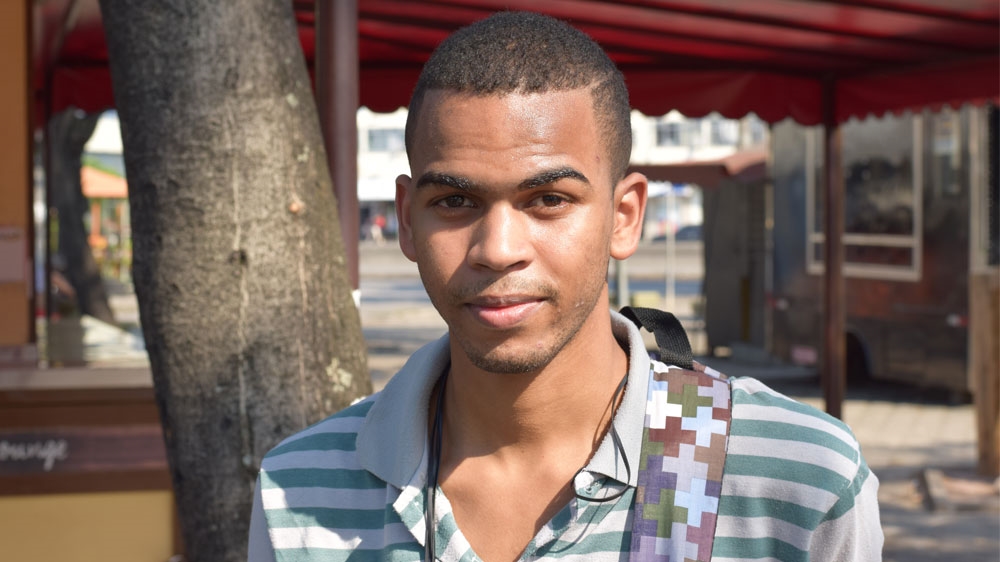 Aspiring engineer Wellington Costa, 19, is balancing education with work [David Child/Al Jazeera]