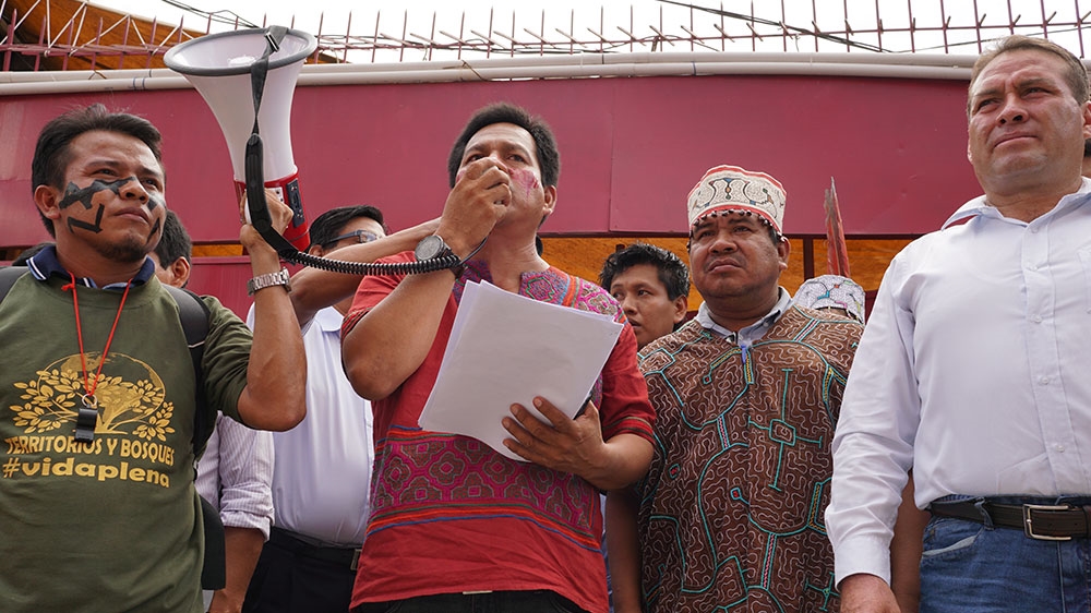 Indigenous leader Robert Guimaraes (centre) calls the waterway project a threat to native food security [Neil Giardino/Al Jazeera]