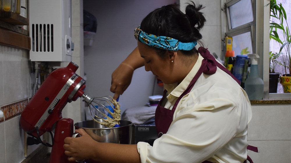 Aline Domingues da Rosa, 28, sells cookies, cakes and other confectionaries [David Child/Al Jazeera]