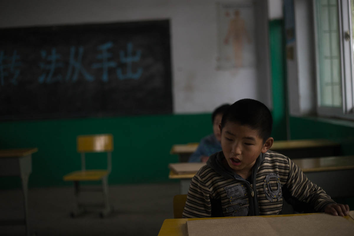 Students recite from their Braille textbooks.