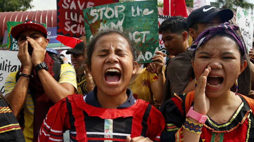 Indigenous people held a protest in Manila on December 10 to oppose plans to extend martial law in Mindanao [Bullit Marquez/AP Photo]