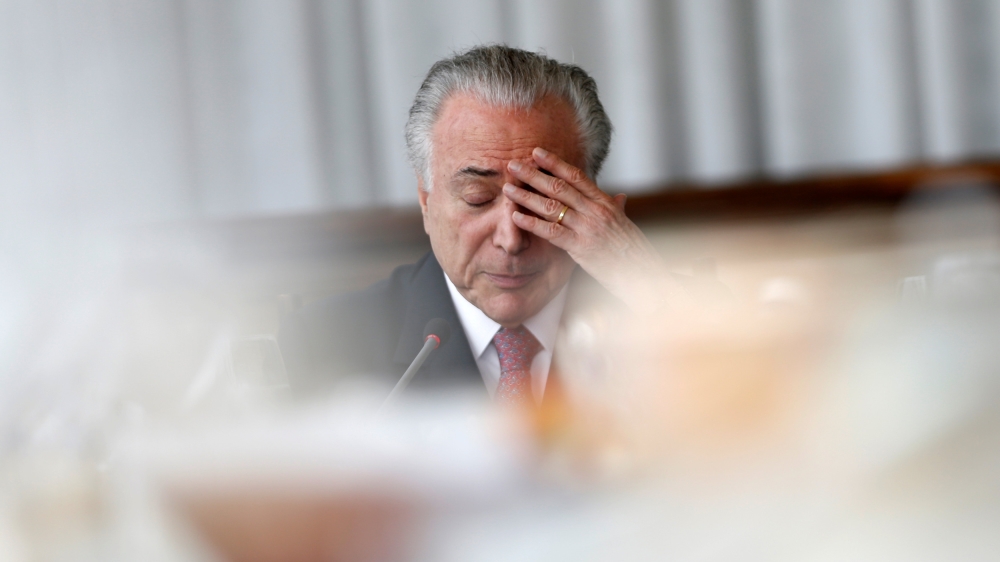 Brazil''s President Michel Temer reacts during a breakfast with foreign media at Alvorada Palace in Brasilia
