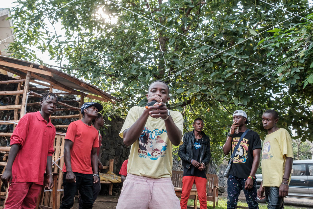 Nelcash Babak (20) going all out for his rap solo. The worst fear of the group is that they get forcefully recruited and kidnapped by one of the many rebel militias that are operating in a bloody war