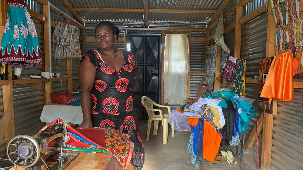 Irene Obahiambo stands in her workshop in Kawangware slum, Nairobi [William Worley/Al Jazeera]