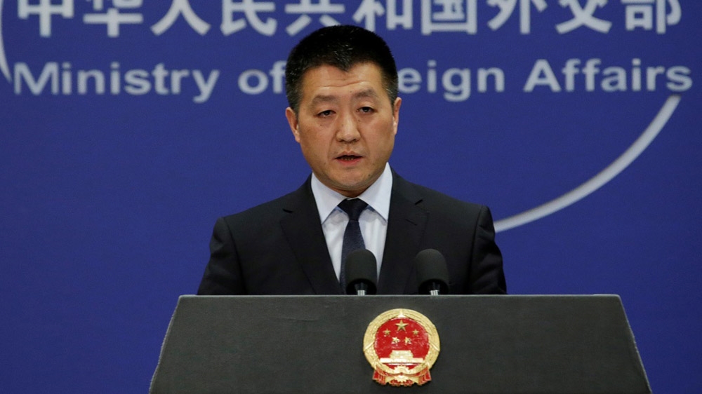 Foreign Ministry spokesman Lu Kang calls for 'lasting peace' [File: Jason Lee/Reuters]