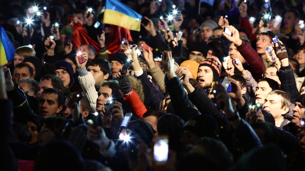 Hundreds of thousands of people occupied Kiev's Independence Square to demand an end to corruption and the resignation of then-president Viktor Yanukovich [Screengrab/Al Jazeera]