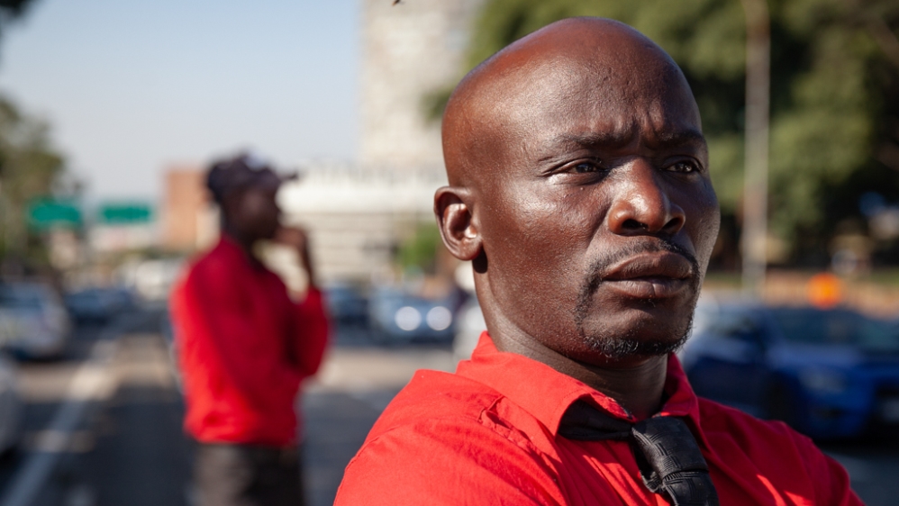 Safety warden Bennett Ranthoka takes pride in the difference his team have made in the area [Tshego Mmahlatji/Al Jazeera]