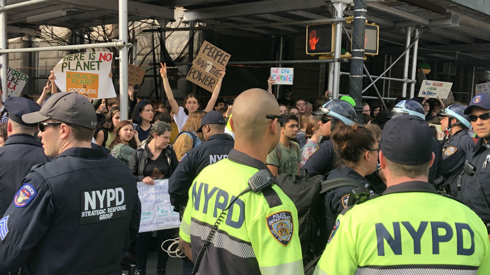 Demonstrators highlighted the Green New Deal resolution proposed by Congresswoman Alexandria Ocasio-Cortez and Senator Ed Markey [Ben Piven/Al Jazeera]