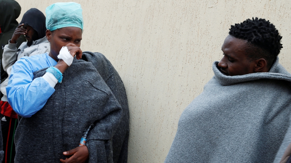 Migrants are seen after being rescued by Libyan coast guard near the western town of Sabratha
