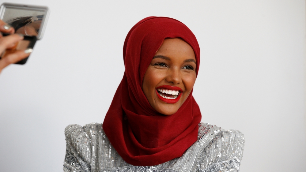Fashion model and former refugee Halima Aden, who is breaking boundaries as the first hijab wearing model gracing magazine covers and walking in high profile runway shows has her makeup applied during