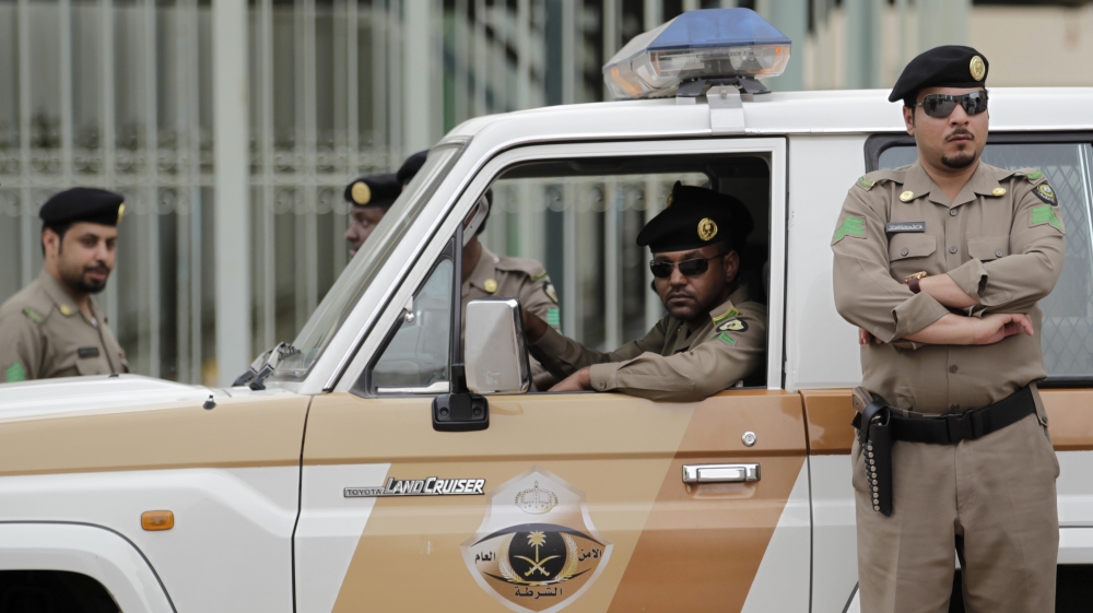 Saudi policemen form a check point near the site where a demonstration was expected to take place in Riyadh, Saudi Arabia, Friday, March 11, 2011