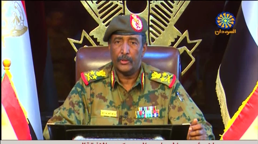 Lieutenant General Abdel Fattah al-Burhan, the new chief of Sudan's ruling military council, vowed to 'uproot the regime' of deposed leader Omar al-Bashir [Sudan TV/AFP]