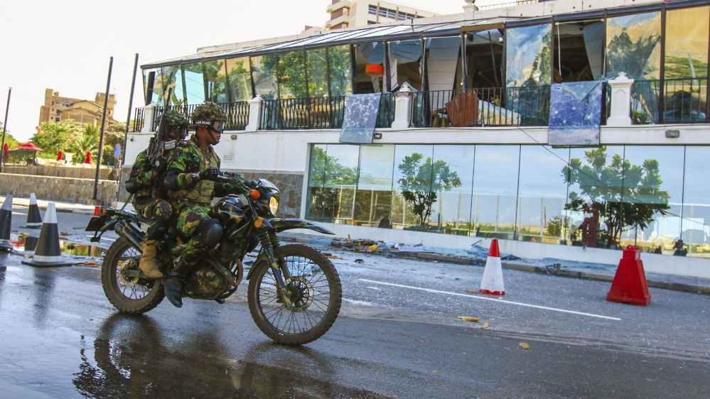 Sri Lankan Soldiers on a motorcycle drives past Kingsbury Hotel, which was attacked by a suicide bomber, in Colombo, Sri Lanka, Monday, April 22, 2019. A government crime investigator says the coordin