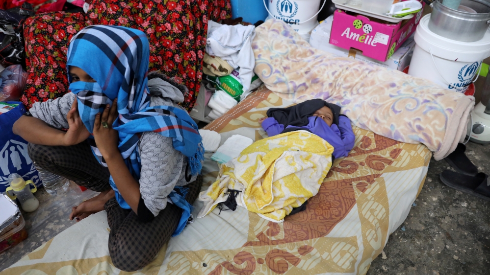 Migrants are seen at the Anti-Illegal Immigration Agency in al-Nasr detention center in Zawiya, west of Tripoli