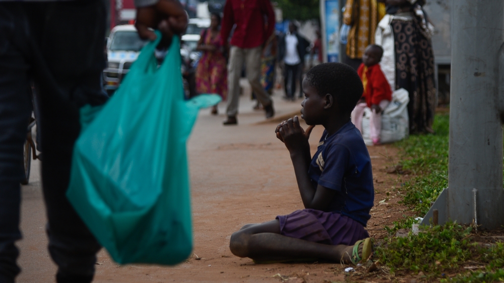 Kampala Street Children Gifts Ban [Isaac Kasamani/Al Jazeera]